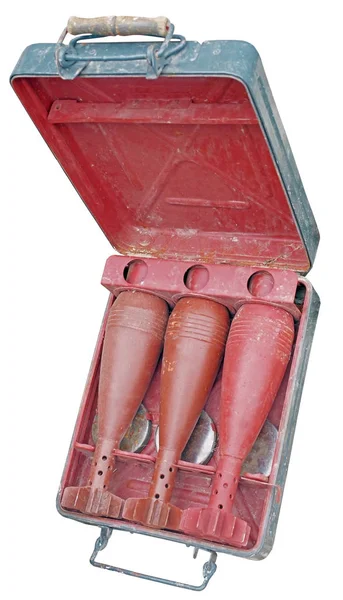 old mortar shells in a portable case on white background