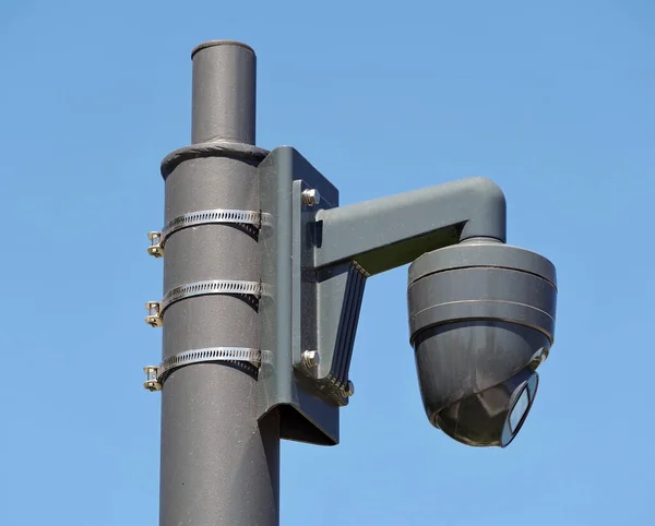 Spherical IP security camera on background blue sky