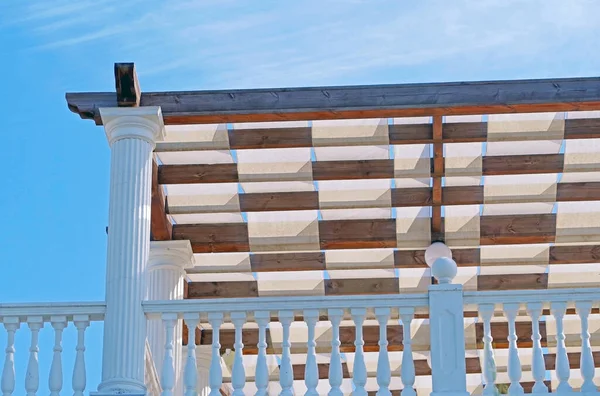 Wooden pavilion, wood pergola for sun protection on the beach