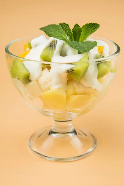 Ice cream with topping in a glass beaker