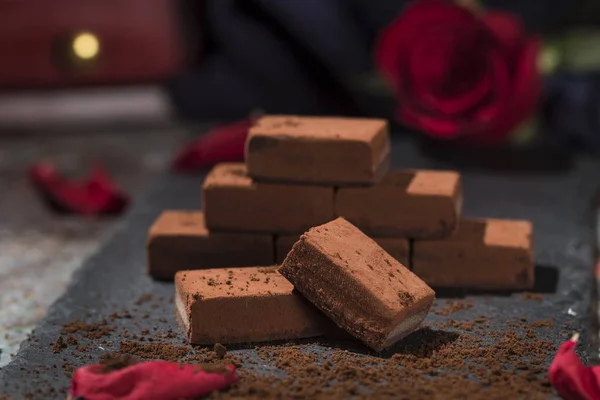 Chocolates and roses on the table