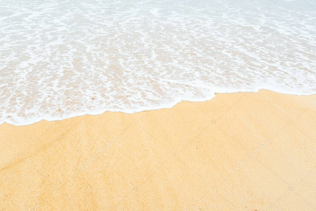 Sand beach and soft focus of sea wave for background