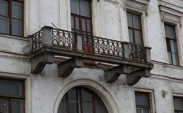 Broken old balcony with no bottom, Fontanka river embankment 23, Saint Petersburg, Russia, September 2020