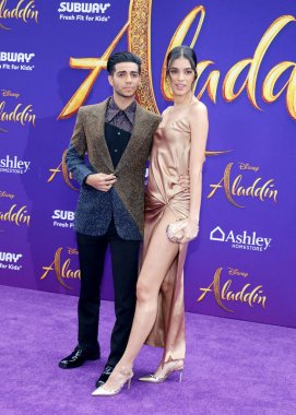 Mena Massoud ve Laysla De Oliveira 21 Mayıs 2019'da Abd'nin Hollywood'daki El Capitan Tiyatrosu'nda düzenlenen 'Aladdin'in Los Angeles galasında.