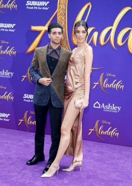 Mena Massoud and Laysla De Oliveira at the Los Angeles premiere of 'Aladdin' held at the El Capitan Theatre in Hollywood, USA on May 21, 2019. clipart