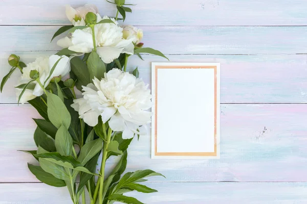 peonies on a wooden background, picture for a blog or article, wedding concept