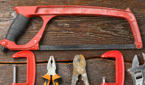 Workshop bench. Variety of hand tools on a wooden table, top view, copy space — Stock Photo, Image