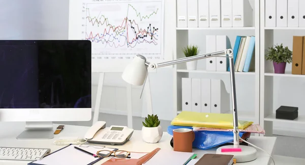 Workplace with notebook laptop Comfortable work table in office windows and city view — Stock Photo, Image