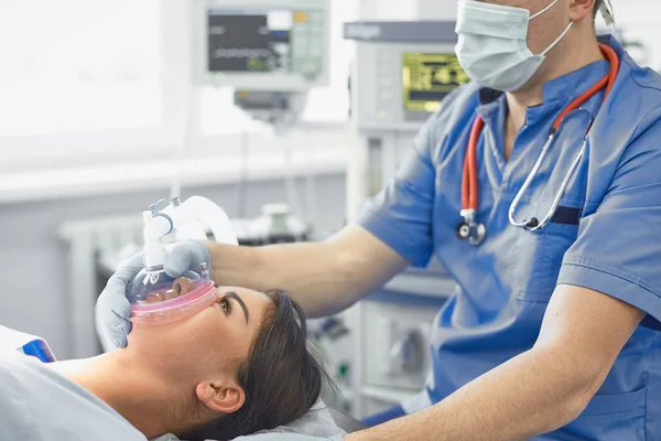 Several doctors surrounding patient on operation table during t — Stock Photo, Image