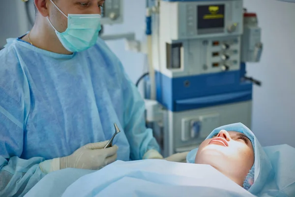 Several doctors surrounding patient on operation table during t — Stock Photo, Image