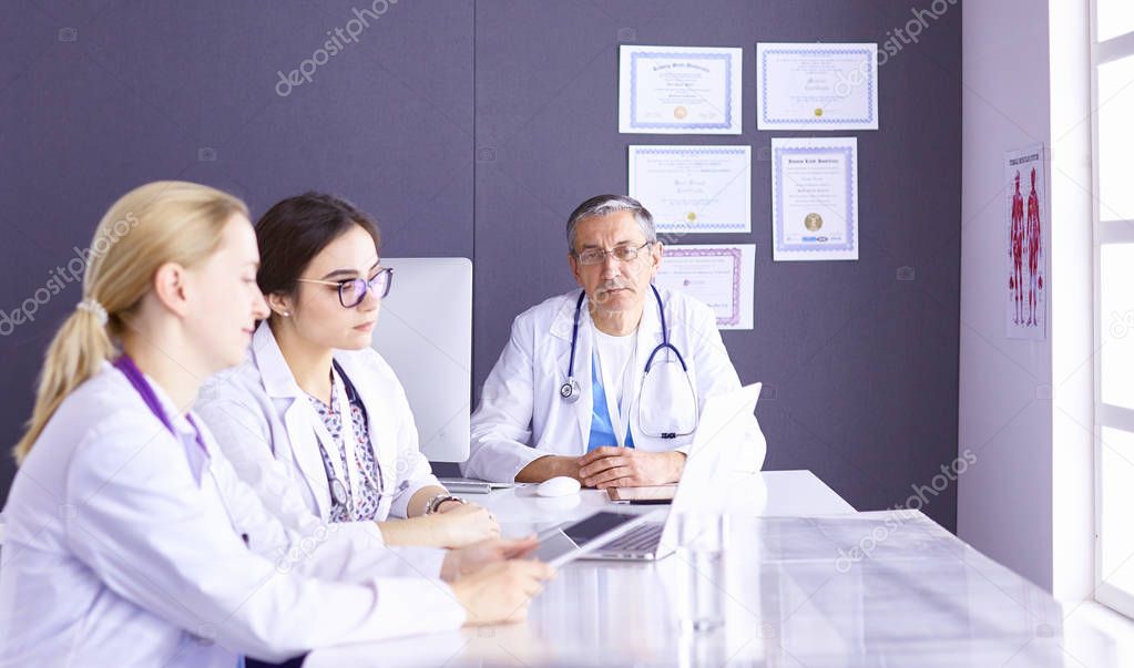 Doctors having a medical discussion in a meeting room