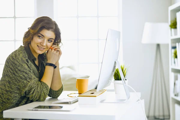 Young woman working with graphic tablet in office — Stock Photo, Image