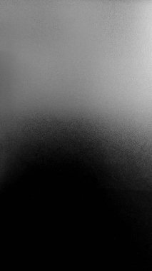 Buzlu cam ve kumlu yüzey. Üst kısmı açık gri renkte ve alttaki koyu ve koyu siyah renge dönüşüyor..