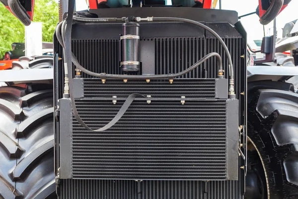 Condenser cooler element on car. Close up cropped photo detail of aluminum automotive grill radiator