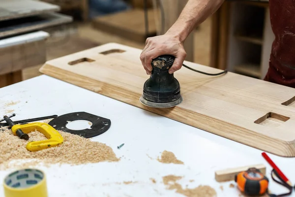 Hobby wood small business concept. Cropped close up photo of cabinetmaker handyman or tradesman make furniture in garage or workroom using special electric tool — Stock Image Hobby Wood Small Business Concept Cropped Close Photo Cabinetmaker Handyman Stock Picture