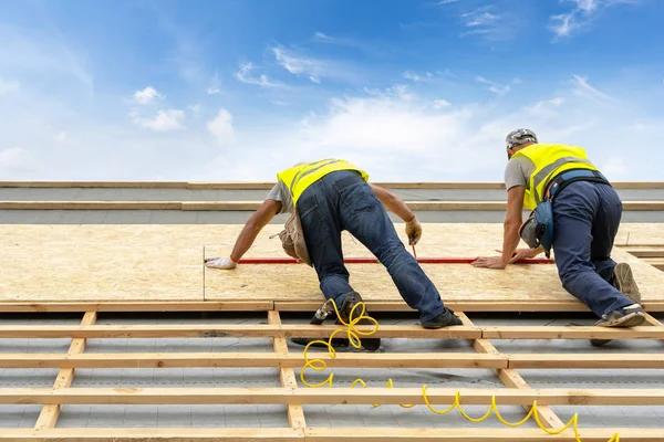 Building construction process of new wooden roof on wood frame h