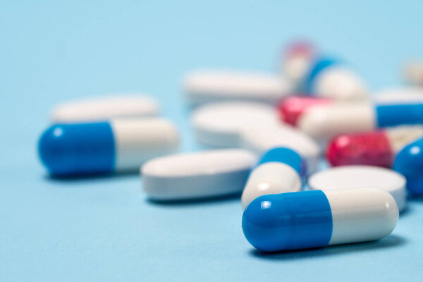 Studio shot of medical pills on blue background