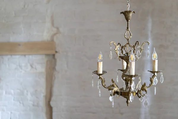 Crystal chandelier lamp against white wall with copy space — Stock Photo, Image