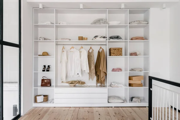 modern and large wardrobe in dressing room with