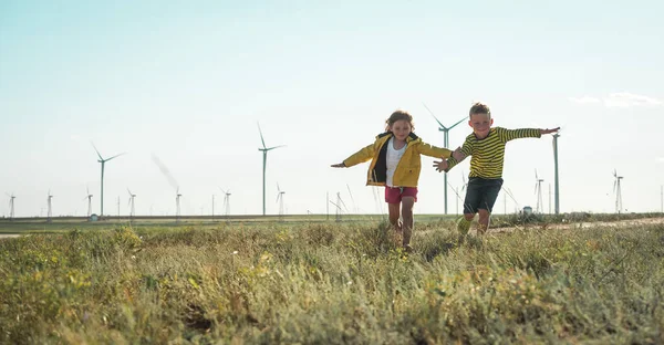 Little Girl Boy Running Front Windmills Renewable Energies Sustainable Resources — Stock Photo, Image