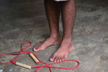 A man is Skipping. Jumping rope, also known as skipping, is a highly effective and accessible full-body workout with a wide range of benefits for your physical and mental health.