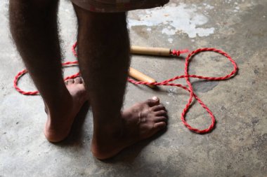 A man is Skipping. Jumping rope, also known as skipping, is a highly effective and accessible full-body workout with a wide range of benefits for your physical and mental health.