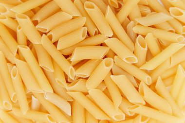 pişmemiş makarna yığını. üstten görünüm. arka plan. yakın çekim. İtalyan yemeği veya mutfağı