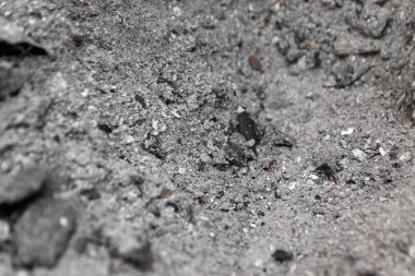 Fırının arka planındaki gri kül, şömineden çıkan kül, kül, kül, odun külleri.