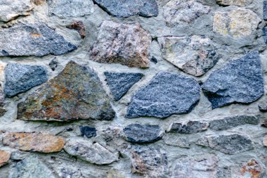 Arka plan için yontulmuş bir taştan duvar parçası