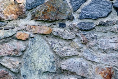 Arka plan için yontulmuş bir taştan duvar parçası