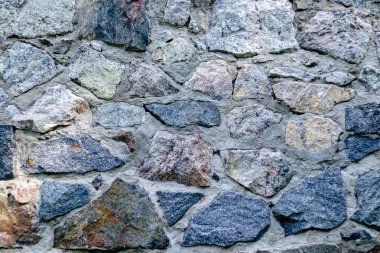 Arka plan için yontulmuş bir taştan duvar parçası