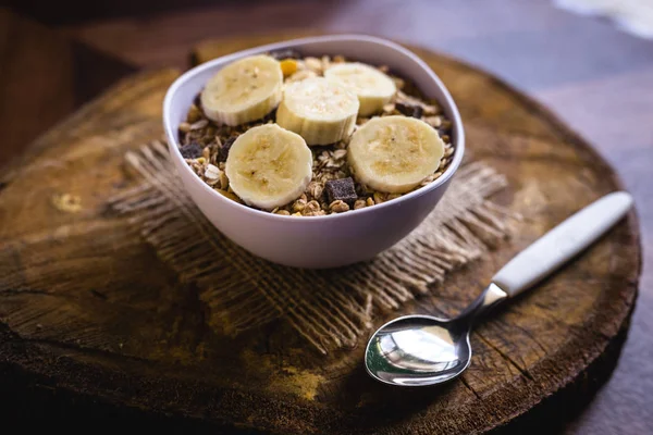 Cereal, seeds and oats, and banana slices, a healthy meal for breakfast or afternoon snack.