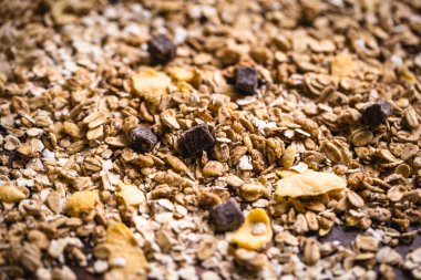 çeşitli tohum, granola, yulaf ve çeşitli tahıl bir masanın üzerinden dağınık. Bir doku veya arka plan görüntü.