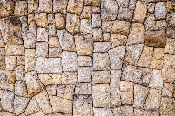 Aged decorative stones for rustic wall. Background texture with stones.