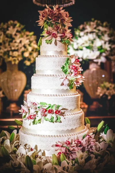 Wedding cake, cake for a wedding. Cake decoration with colorful flowers.