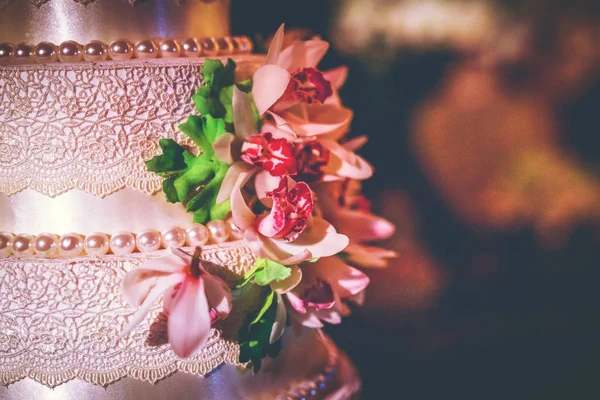 Wedding cake, cake for a wedding. Cake decoration with colorful flowers.