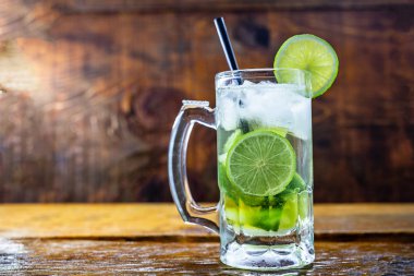 Beer caipirinha. Brazilian exotic drink of beer with lemon and cachaça.