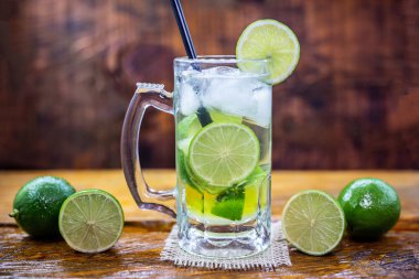 Beer caipirinha. Brazilian exotic drink of beer with lemon and cachaça.