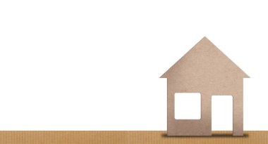 Görüntü arka planı, ev veya güvenlik kavramı. metin için oda ile bir karton ev görüntüsü.