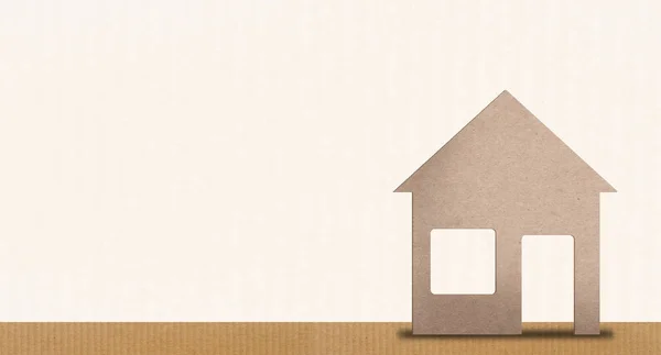 Beeld achtergrond, thuis-of beveiligingsconcept. afbeelding van een kartonnen huis met ruimte voor tekst. — Stockfoto