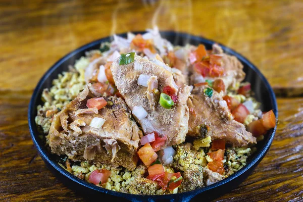 Pork ribs with slight heat vapor, hot food, in Minas Gerais. Typical food of the state of Minas Gerais, Brazil. — Stock Image Pork ribs with slight heat vapor, hot food, in Minas Gerais. Typical food of the state of Minas Gerais, Brazil. Royalty Free Stock Photos