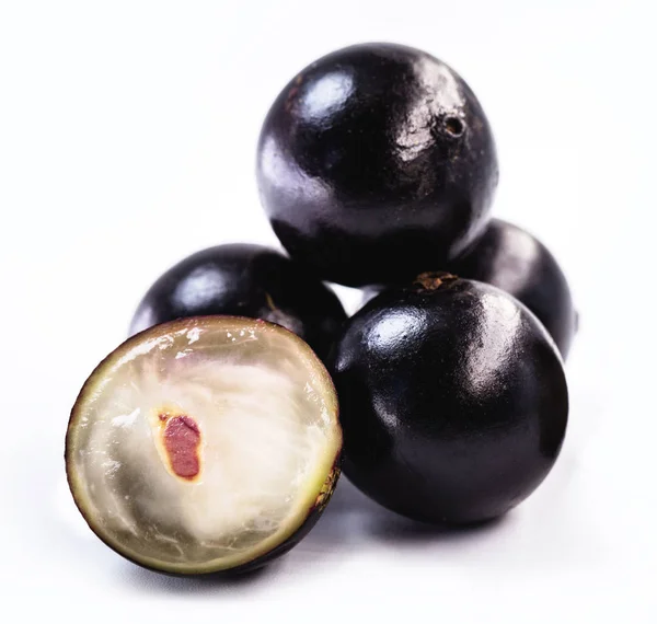 The jabuticaba or jabuticaba is a purplish black-white fruit, typical fruit of Brazil, on isolated white background. Rare organic and healthy fruits in South America, also known as Brazilian grapes. — Stock Photo, Image