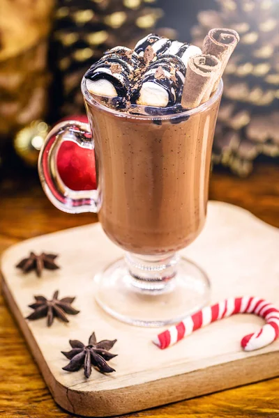 Hot chocolate, typical winter drink served at Christmas is winter in Europe and the United States of America. Chocolate with marshmallow and Christmas decoration.