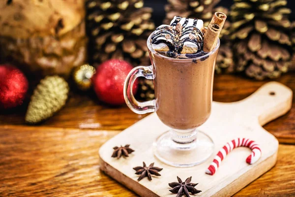 Hot chocolate, typical winter drink served at Christmas is winter in Europe and the United States of America. Chocolate with marshmallow and Christmas decoration.