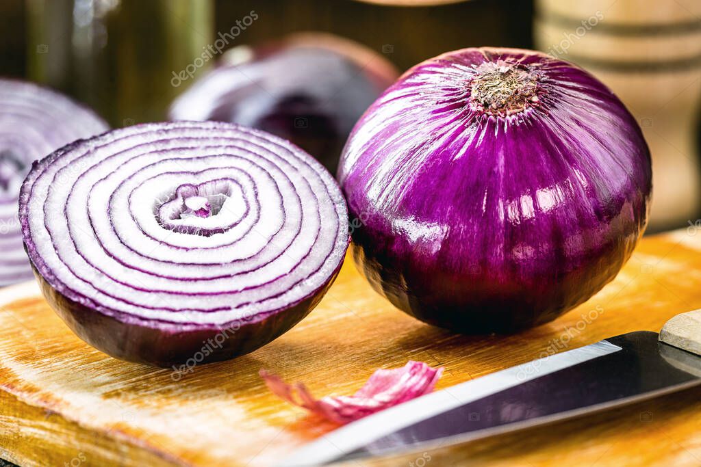 red onion from brazil, vegetable rich in anthocyanin, powerful antioxidant that helps fight free radicals. Healthy food in rustic kitchen.