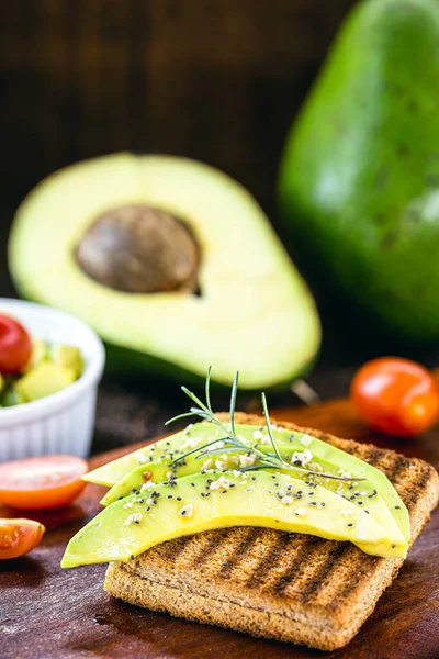 avocado with wholemeal bread and toasted in the morning, healthy eating. Avocado and cream pate with bread.