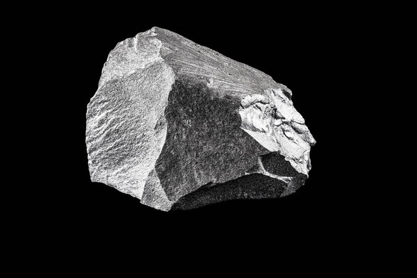 silver ore, iron for industrial use. Stone isolated on black background, mineral extraction.