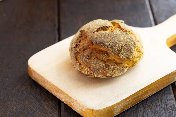 small corn bread, called broinha or broa. Made with flour and corn or cornmeal.