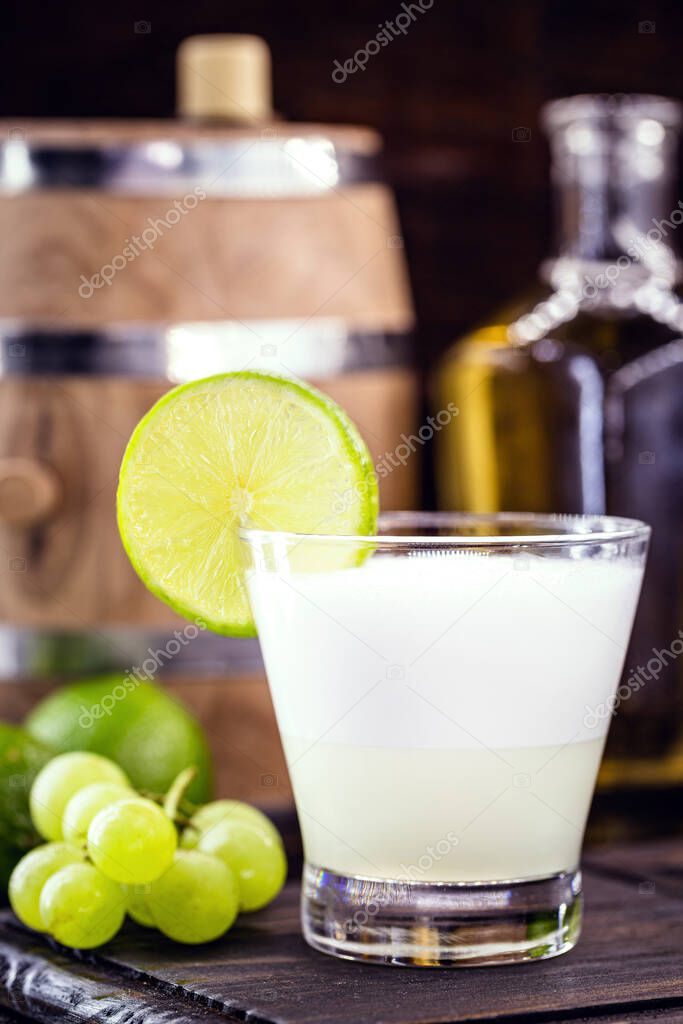 Pisco sour, a typical cocktail of South American cuisine, Peru and Chile, prepared based on pisco and lemon, sweetened with brandy, eggs, served cold.