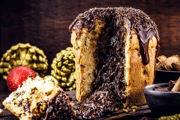 sliced chocolate panettone with dripping chocolate filling, typical Christmas dessert in Brazil and Italy.